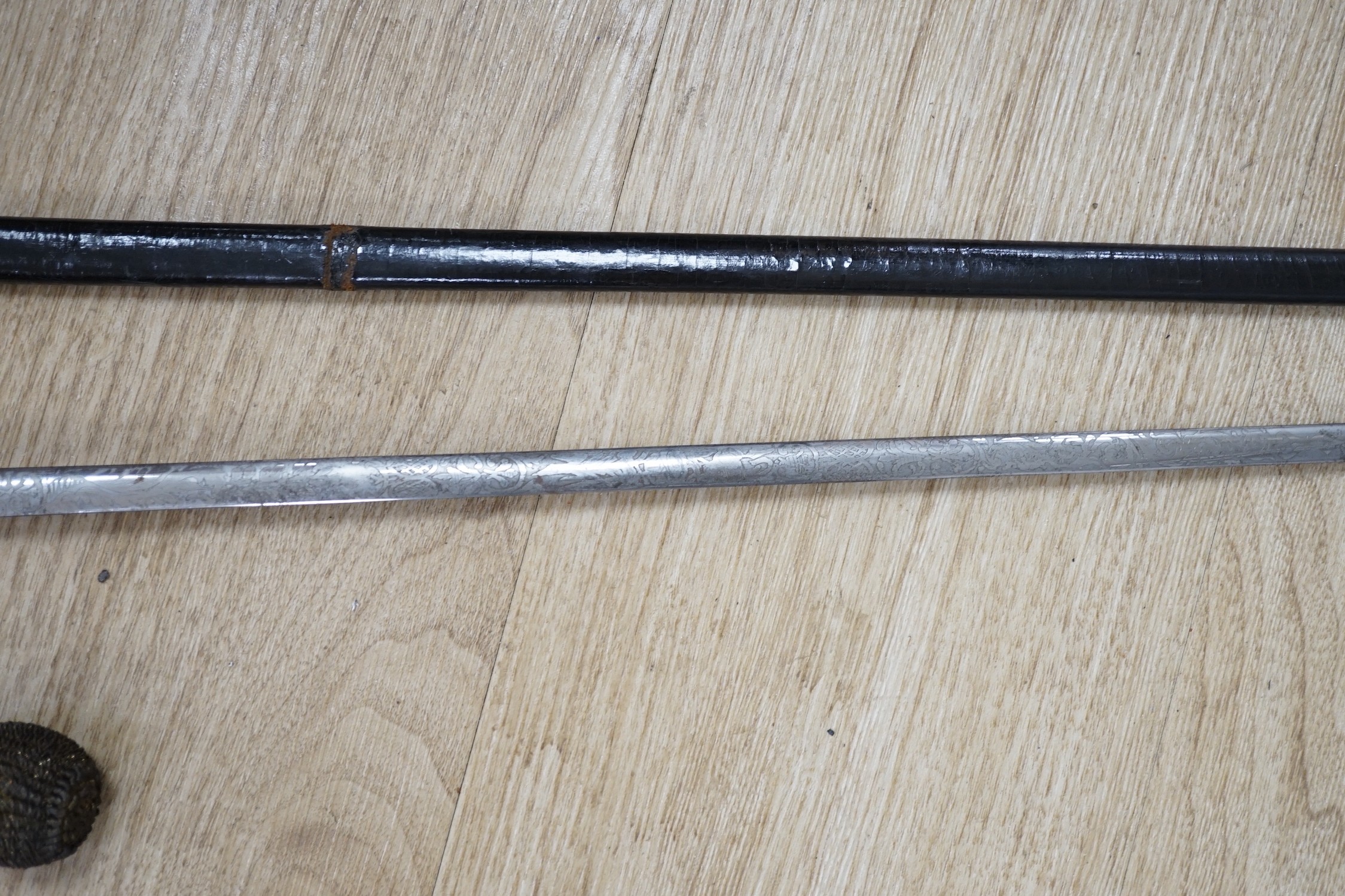 A 19th century officer's dress sword, made by Silver &Co. London with scabbard and leather cover